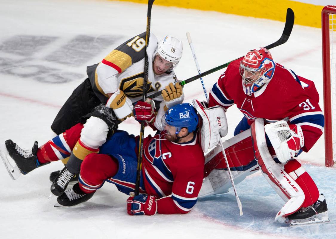 Vegas Golden Knights right wing Reilly Smith (19) battles with Montreal Canadiens defenseman Sh ...