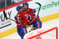 Montreal Canadiens' Artturi Lehkonen (62) celebrates his game-winning goal with teammate Philli ...