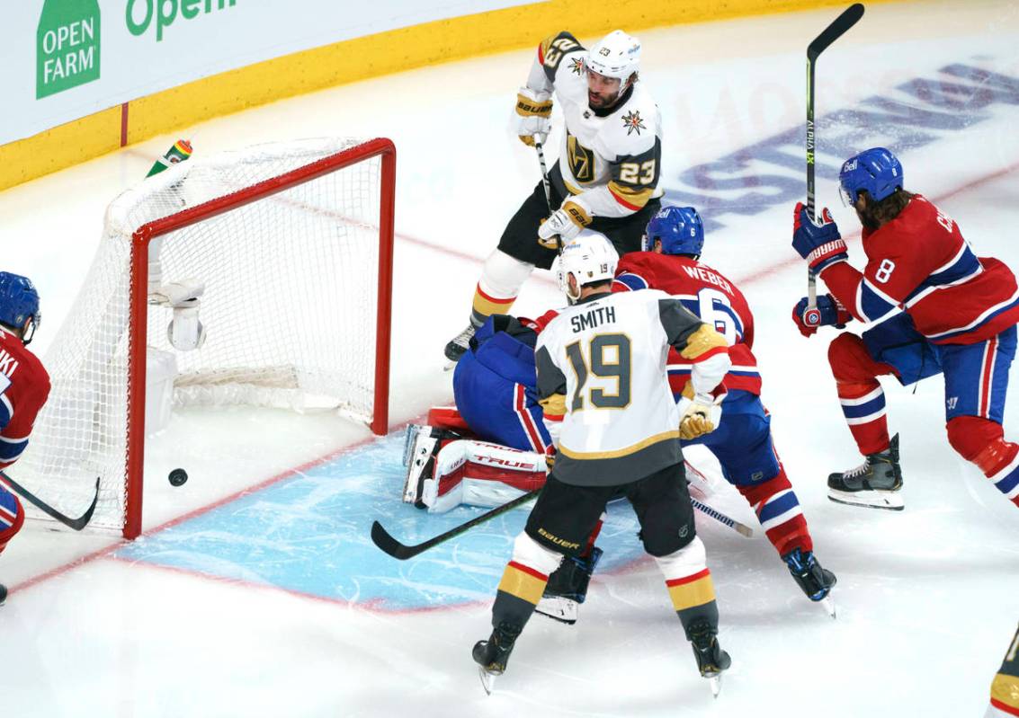Vegas Golden Knights' Alec Martinez (23) scores past Montreal Canadiens goaltender Carey Price ...