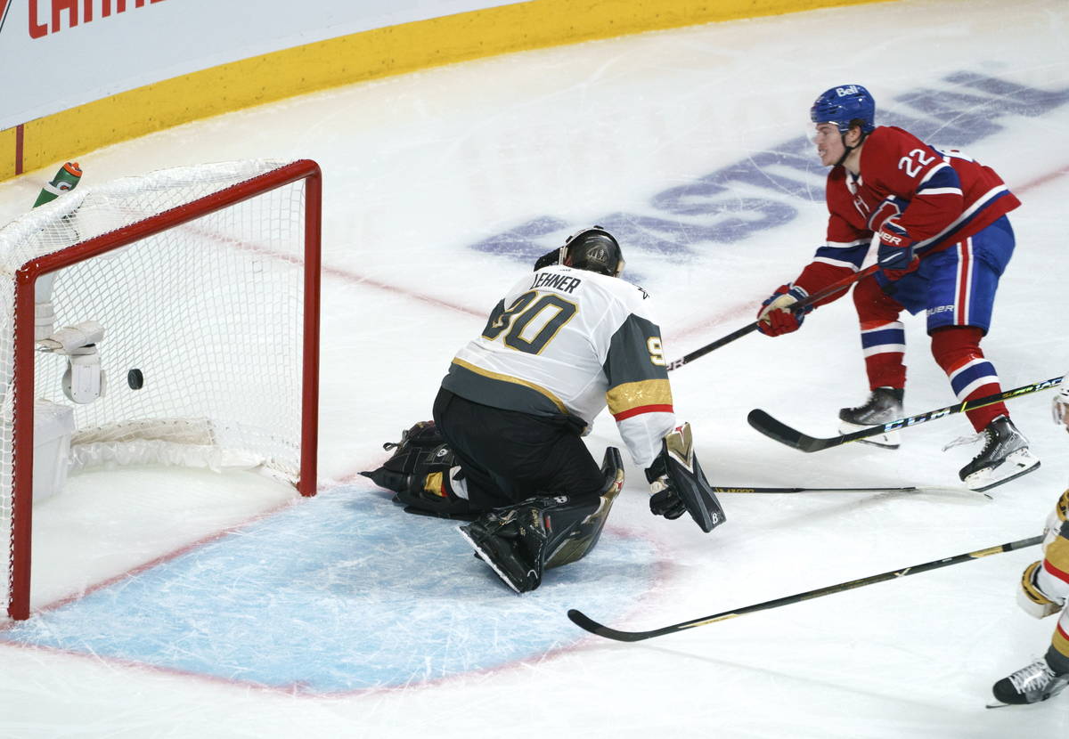Montreal Canadiens' Cole Caufield (22) scores past Vegas Golden Knights goaltender Robin Lehner ...