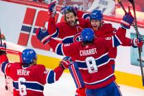 Montreal Canadiens left wing Artturi Lehkonen (62) celebrates with teammates after scoring the ...