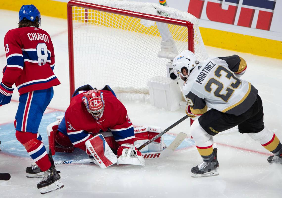 Vegas Golden Knights' Alec Martinez (23) scores on Montreal Canadiens goaltender Carey Price (3 ...