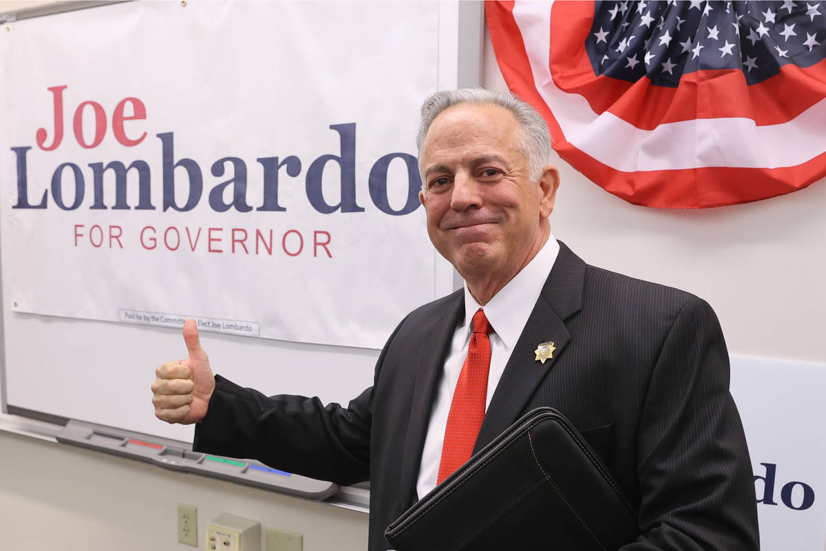 Clark County Sheriff Joe Lombardo poses with his campaign sign after announcing his candidacy f ...
