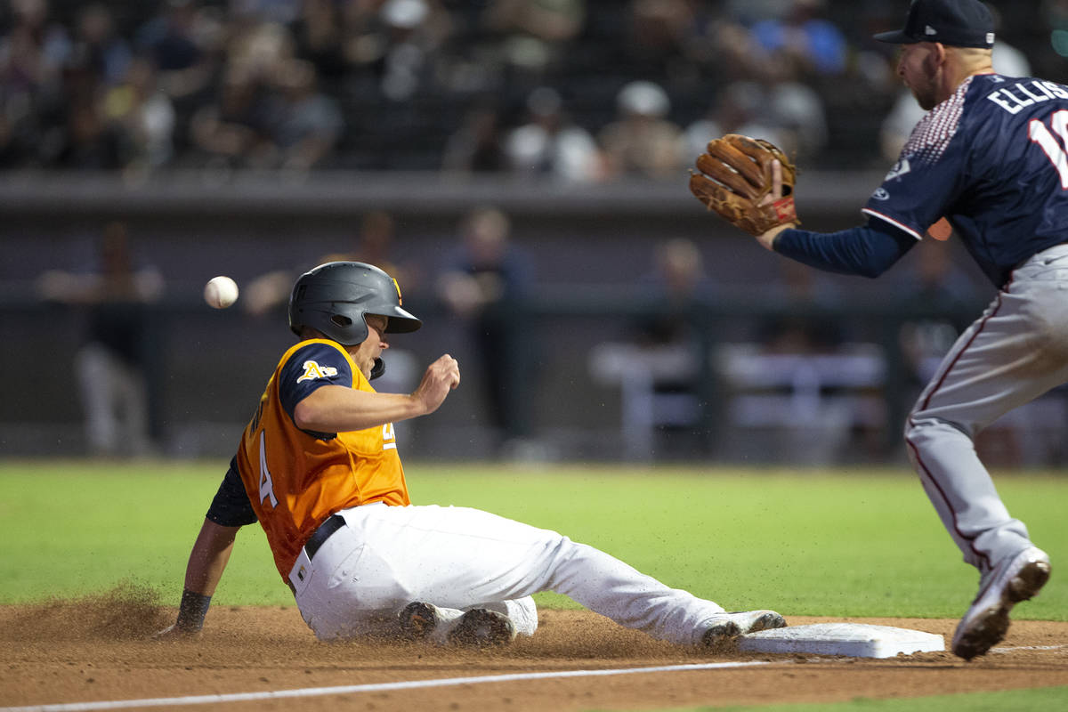 Aviators infielder Jacob Wilson (4) slides safely into third base while Aces third baseman Drew ...