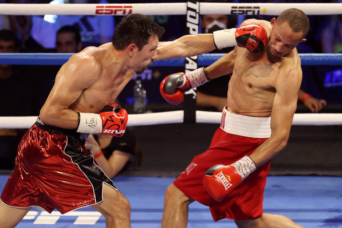 Janibek Alimkhanuly, left, connects a punch against Rob Brant, in the eight round of the middle ...