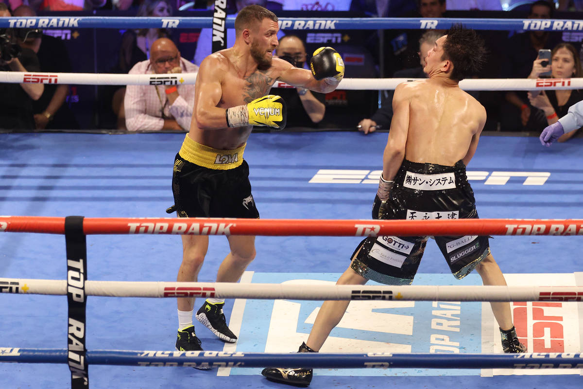 Vasyl Lomachenko, left, connects a punch against Masayoshi Nakatani in the ninth round of the l ...