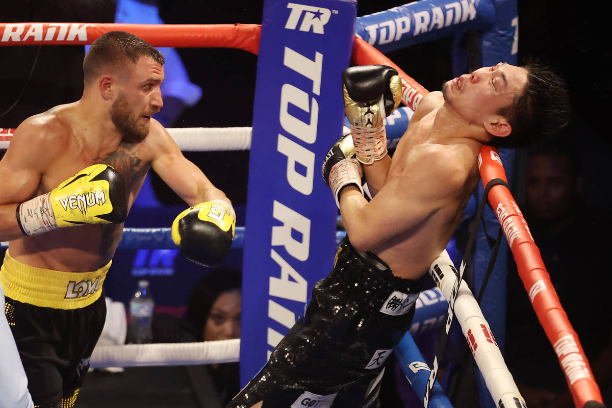 Vasyl Lomachenko, left, connects a punch against Masayoshi Nakatani in the sixth round of the l ...