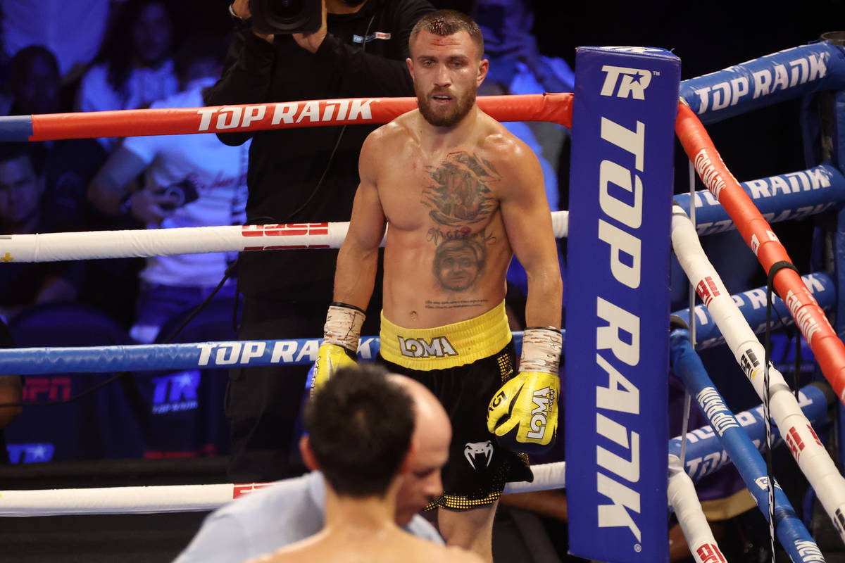 Vasyl Lomachenko looks on after knocking down Masayoshi Nakatani in the fifth round of the ligh ...