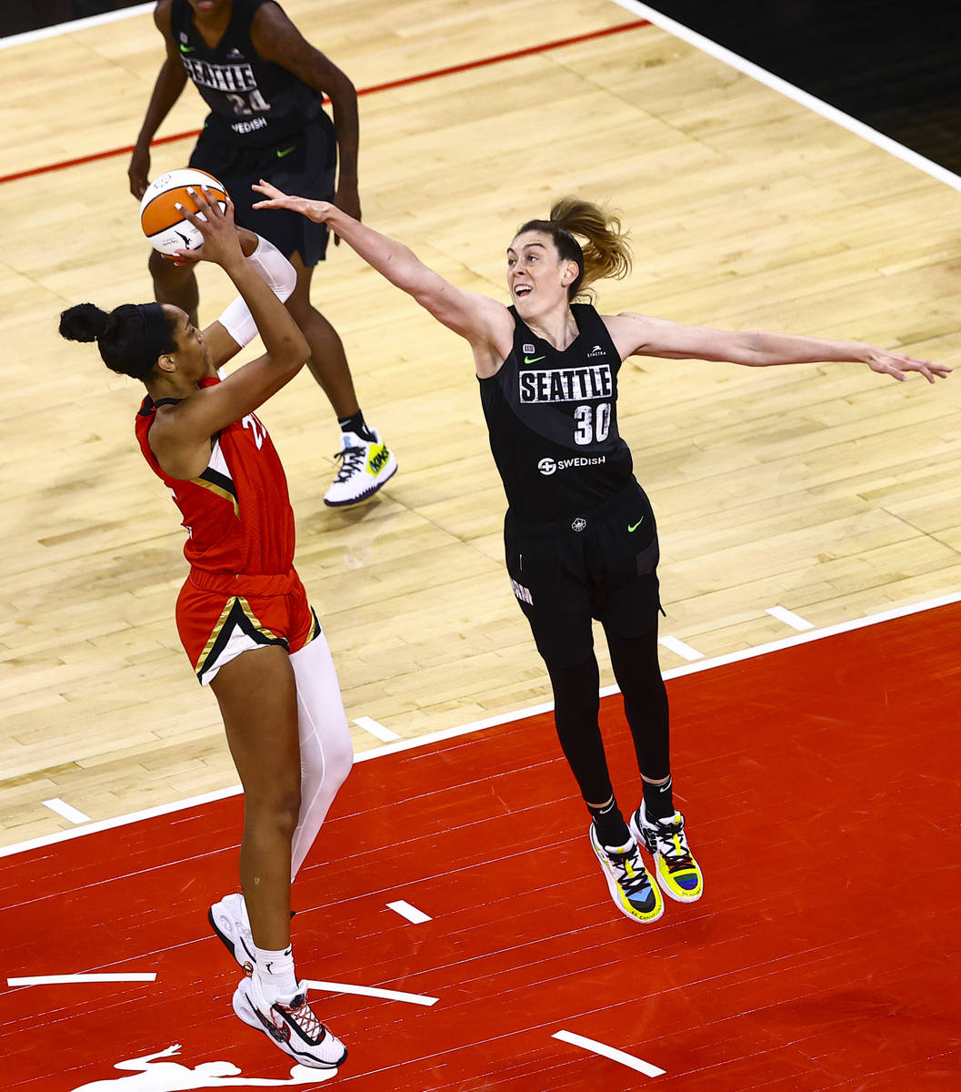 Las Vegas AcesՠA'ja Wilson (22) shoots as Seattle Stormճ Breanna Stewart (30) defen ...