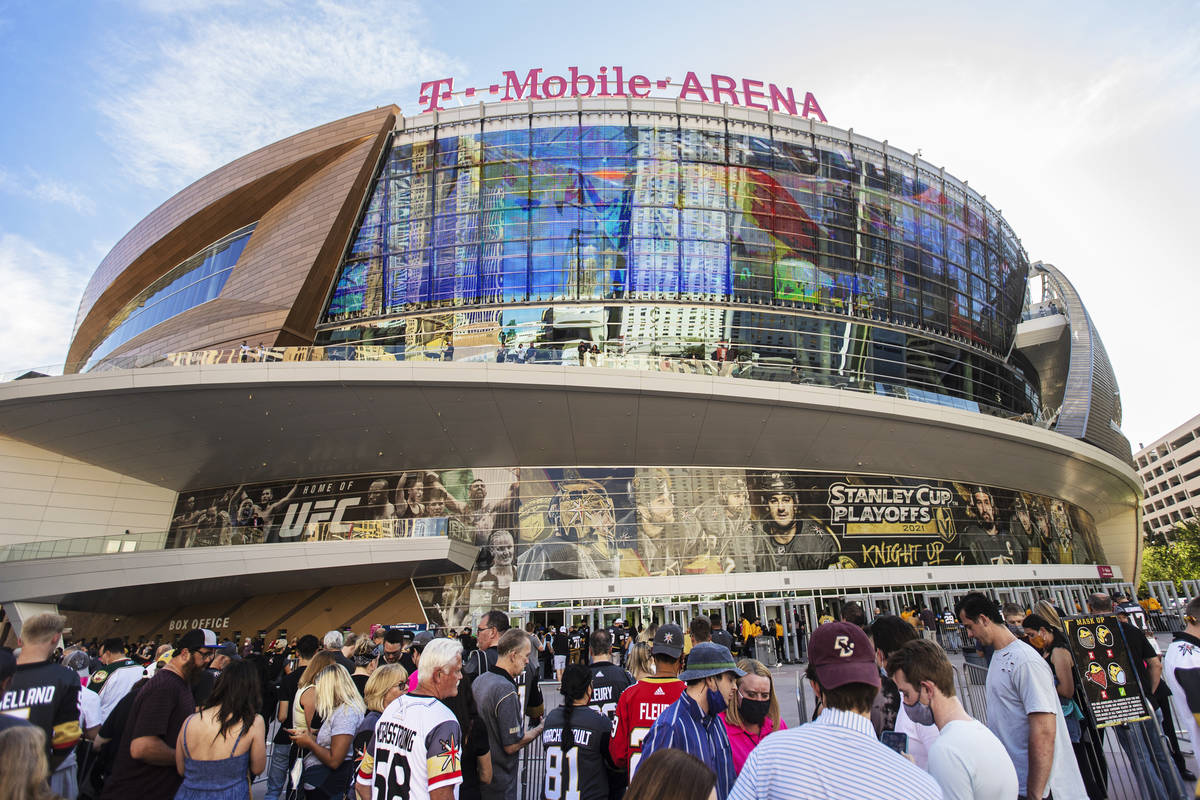 Fans wait to enter T-Mobile Arena before the start of Game 7 of an NHL Stanley Cup first-round ...