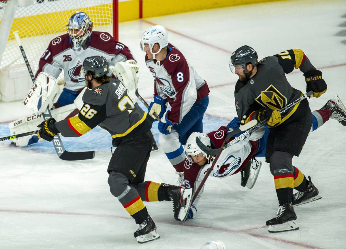 Colorado Avalanche and Golden Knights players battle during the first period in Game 6 of an NH ...