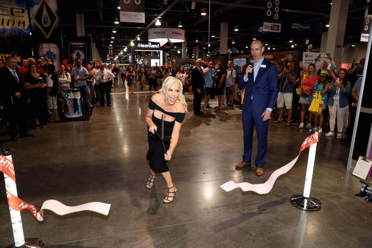 Jenny McCarthy cuts the ribbon to open the show floor for the Nightclub & Bar Show at the L ...