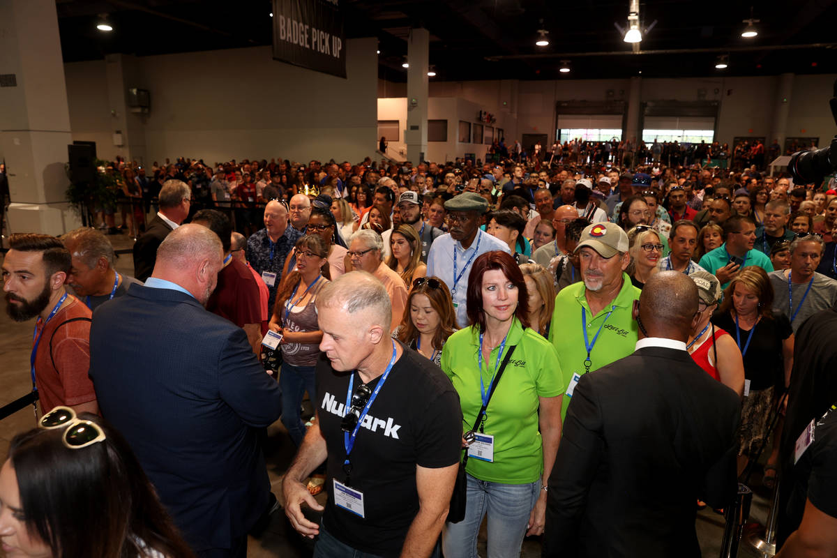 Conventioneers file in as the show floor opens at the Nightclub & Bar Show at the Las Vegas ...