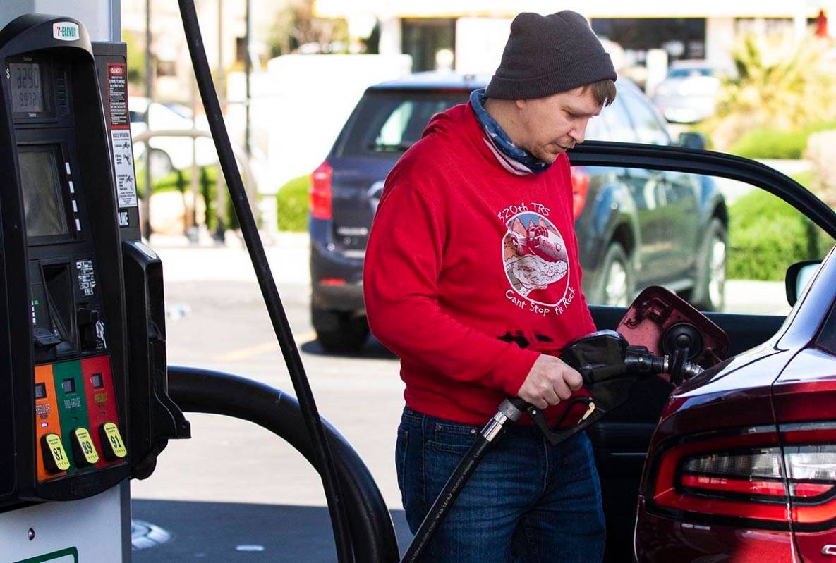 Brandon Edester pumps gas at a 7-Eleven on Monday, March, 15, 2021, in Las Vegas. (Bizuayehu Te ...