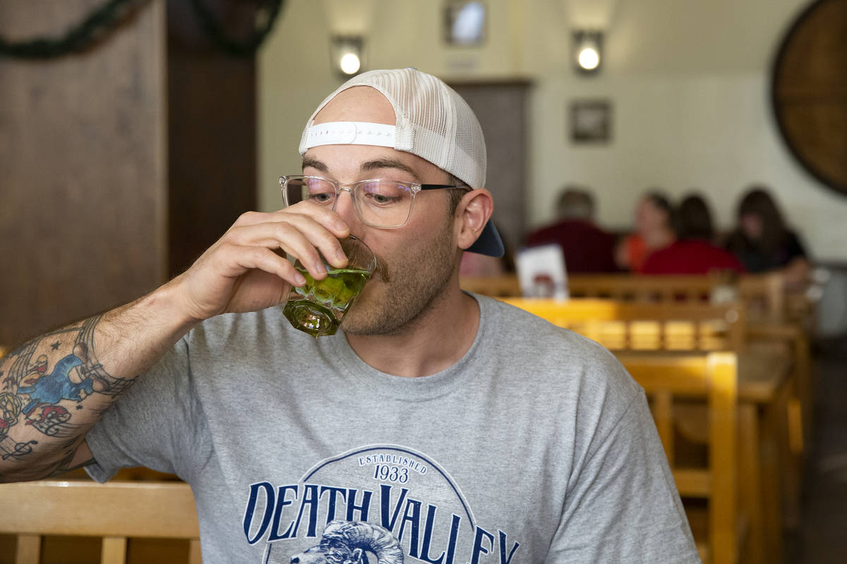 Adam Ross, of Illinois, takes a shot on his 34th birthday at Hofbrauhaus on Thursday, June 17, ...