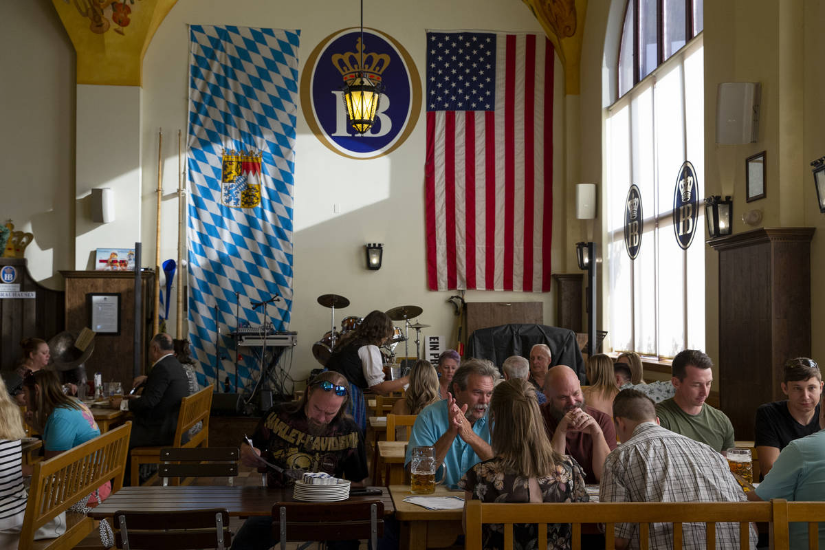 Diners fill traditional German beer hall and restaurant Hofbrauhaus on Thursday, June 17, 2021, ...