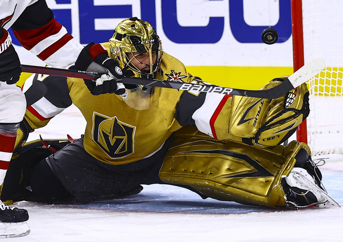 Golden Knights goaltender Marc-Andre Fleury (29) blocks the puck in front of Arizona Coyotes le ...