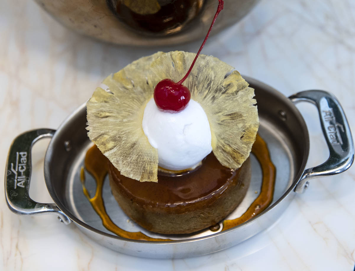 Pineapple upside down cake with a coconut sorbet is displayed at Delilah Supper Club at Wynn, ...