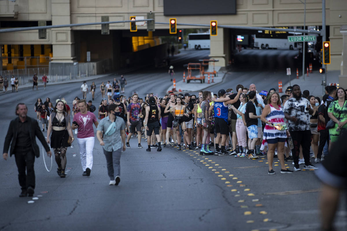 People line up on the Hacienda Avenue bridge to enter Allegiant Stadium in Las Vegas for the Il ...