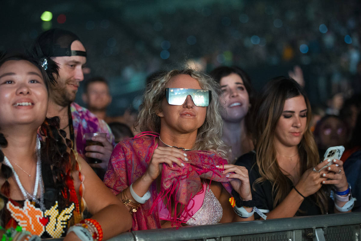 People watch Illenium perform at Allegiant Stadium in Las Vegas, Saturday, July 3, 2021. (Erik ...