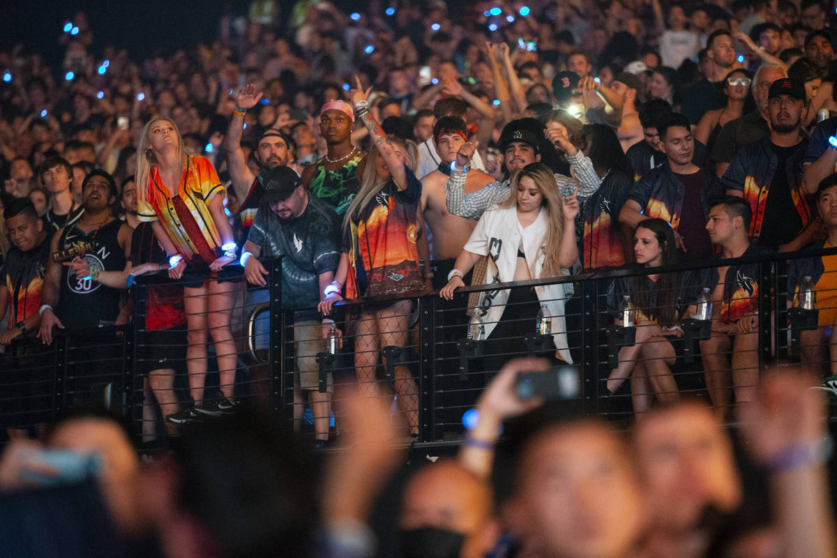 People attend a concert by Illenium at Allegiant Stadium in Las Vegas, Sunday, July 4, 2021. (E ...