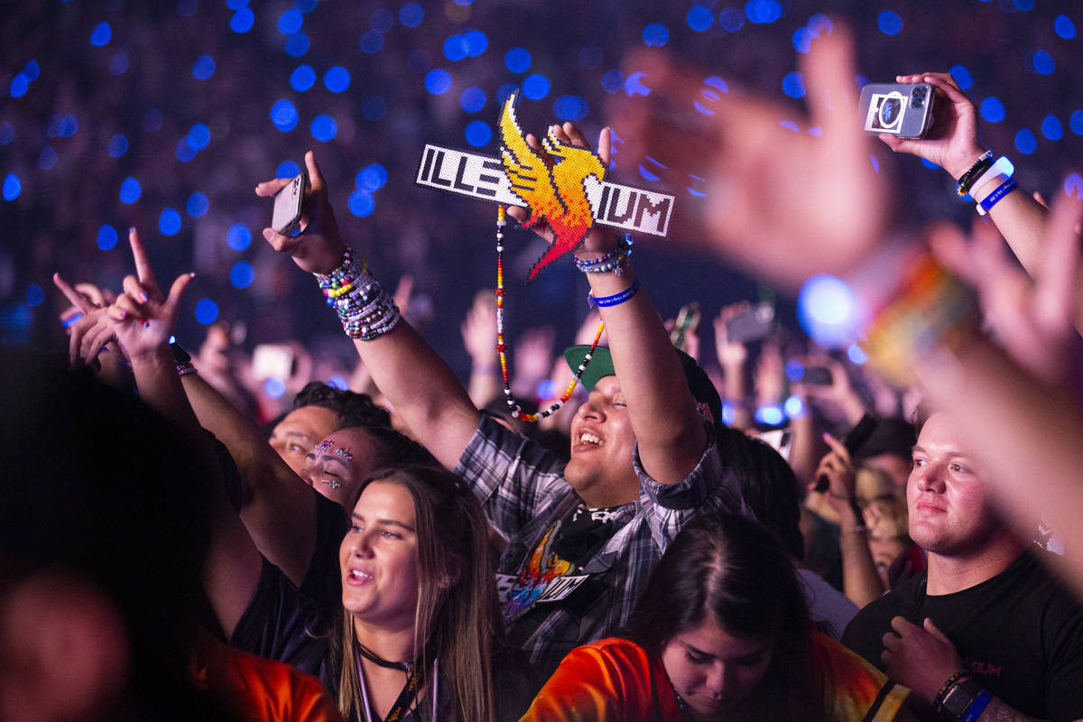 People watch Illenium perform at Allegiant Stadium in Las Vegas, Saturday, July 3, 2021. (Erik ...