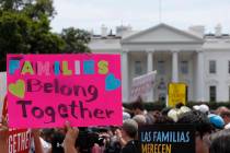 FILE - In this June 20, 2018, file photo, activists march past the White House to protest the T ...