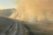 The Tumbleweed brush fire is seen along Interstate 5 in Gorman, Calif., Sunday, July 4, 2021.(L ...