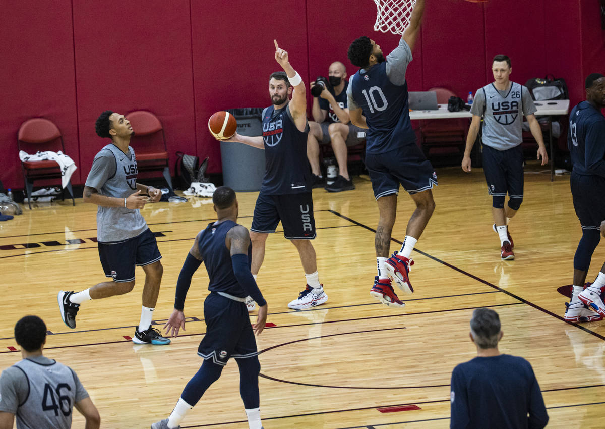 Kevin Love, center, motions to teammates during the first day of USA Basketball practice, ahead ...