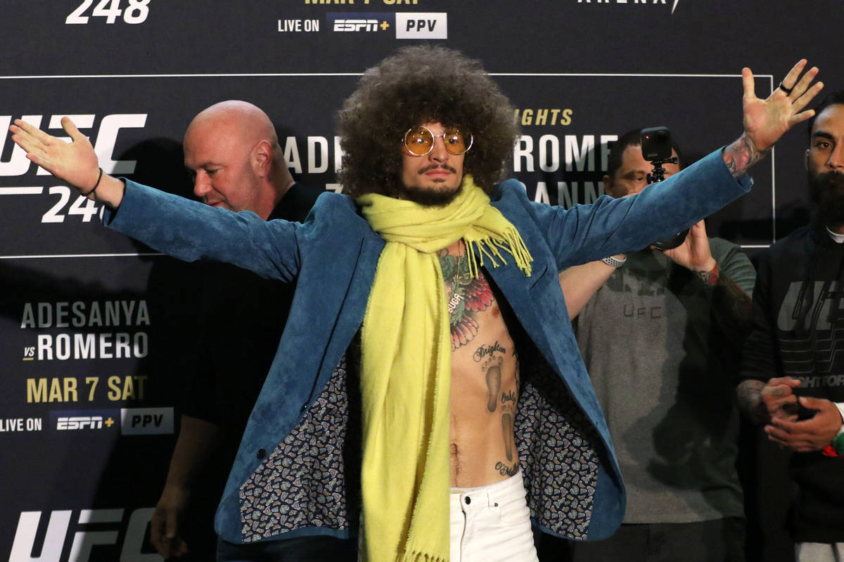 UFC bantamweight Sean O'Malley, left, poses during UFC 248 media day staredown as his opponent ...