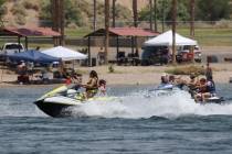 People ride jet skis on the Colorado River in Laughlin (near Bullhead City, Arizona) in June 20 ...