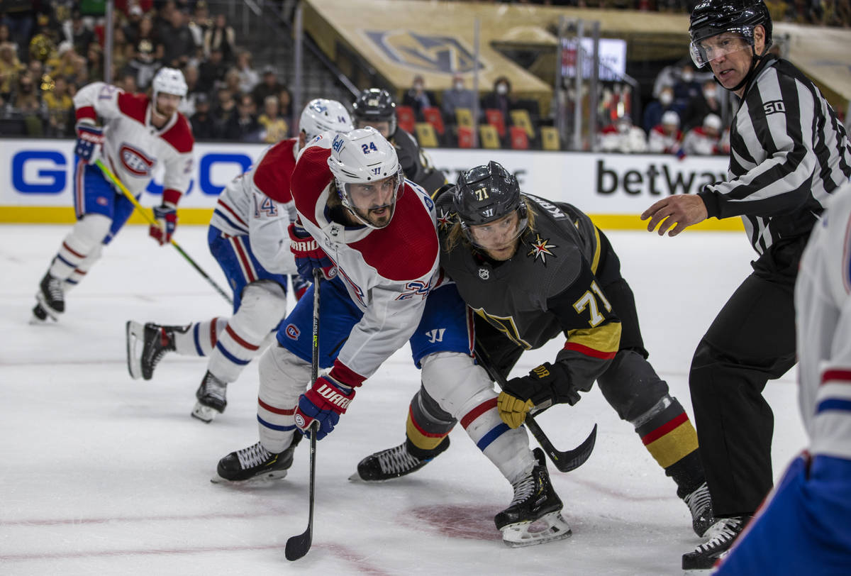 A referee watches the play as Montreal Canadiens left wing Phillip Danault (24) and Golden Knig ...
