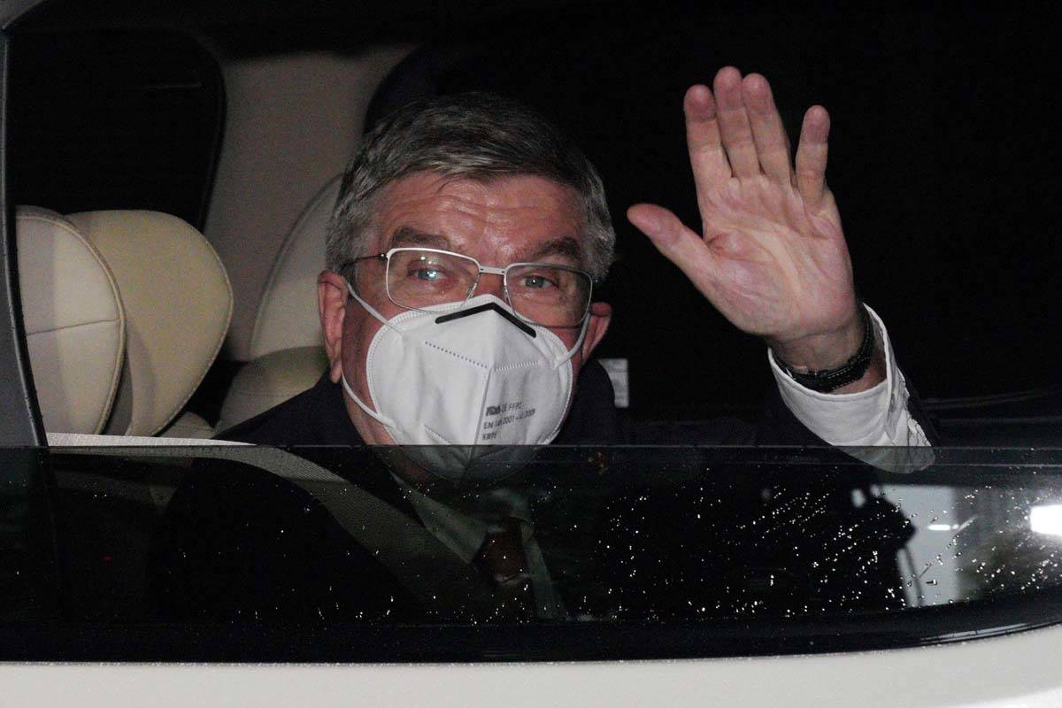 International Olympic Committee (IOC) President Thomas Bach waves from the vehicle to media upo ...