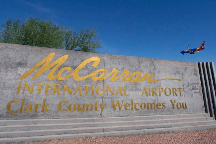 McCarran International Airport sign is seen as a Southwest Airways plane prepares to land on We ...