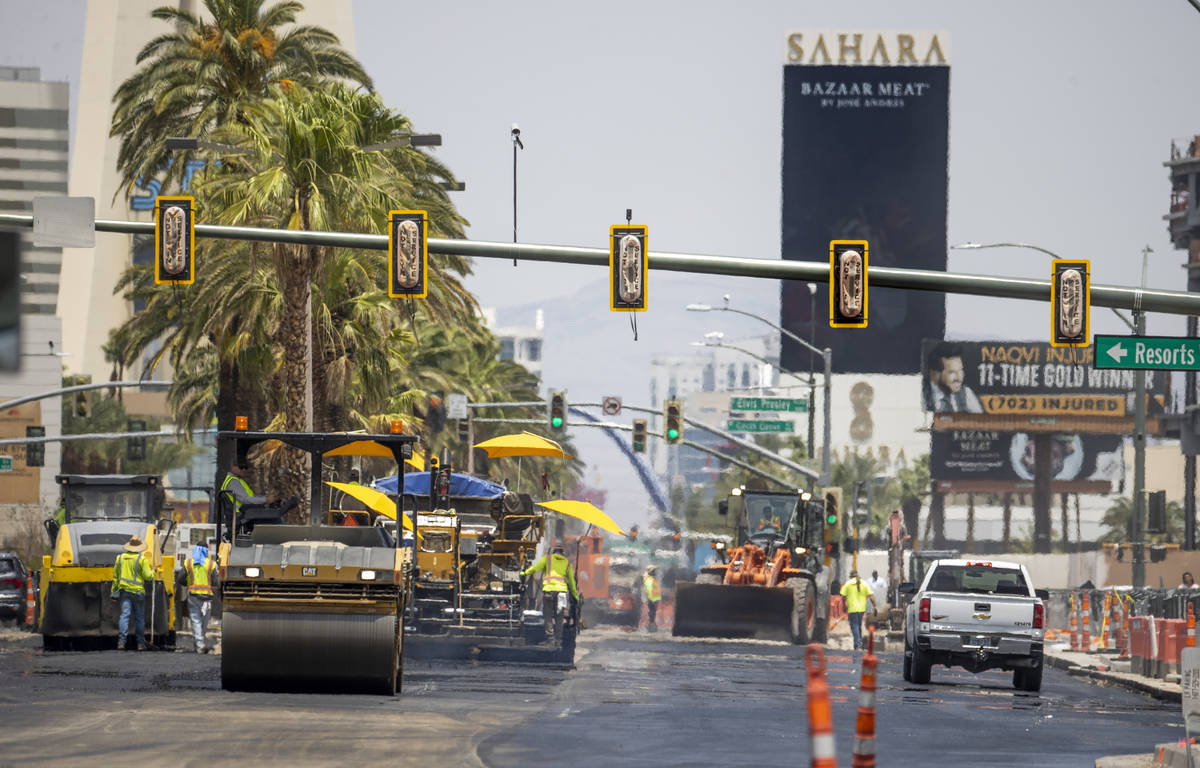 Heat waves rise as construction crews pave S. Las Vegas Boulevard near the Peppermill Las Vegas ...