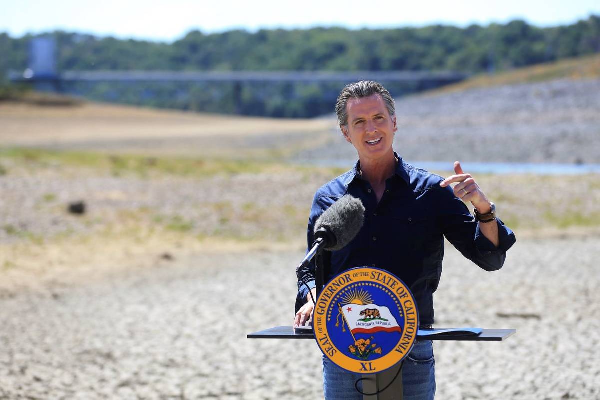 California Gov. Gavin Newsom speaks at a news conference in the parched basin of Lake Mendocino ...