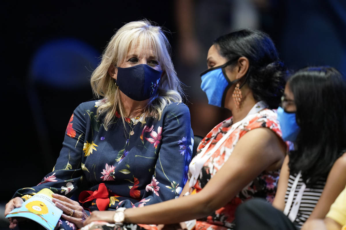 First lady Jill Biden, left, visits with friends and family members of contestants during the f ...