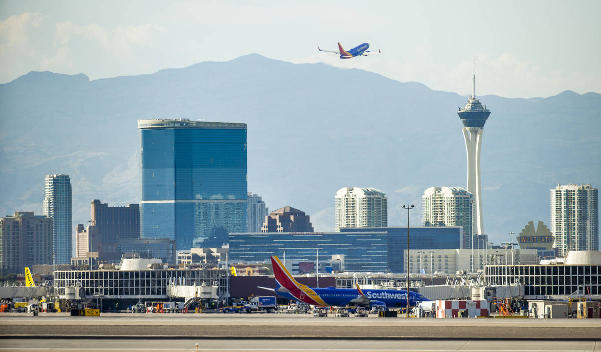 A Southwest plane departs as heat is causing travel delays at McCarran International Airport on ...