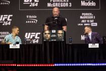 Dustin Poirier, left, with Conor McGregor, right, and UFC president Dana White, participate dur ...