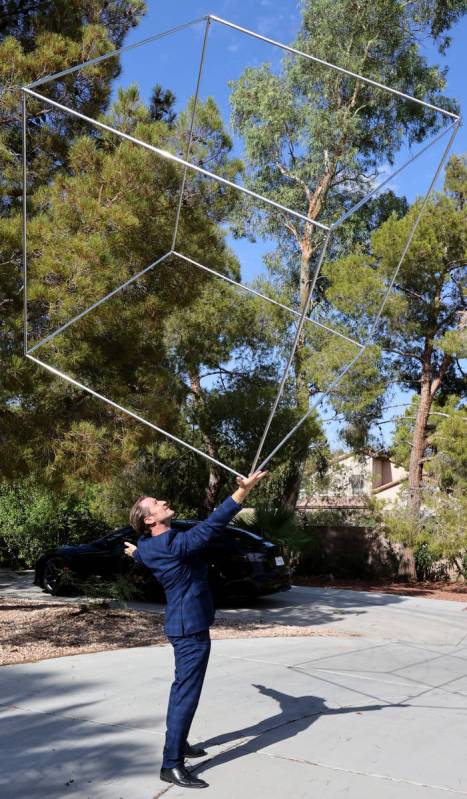 Former Olympian and former Cirque du Soleil performer Paul Bowler spins a cube used in his act ...