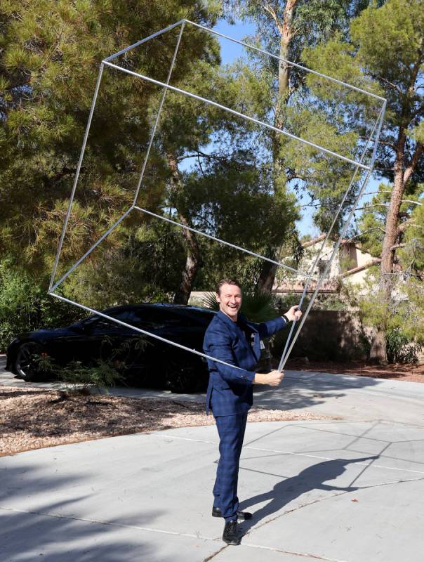 Former Olympian and former Cirque du Soleil performer Paul Bowler spins a cube used in his act ...