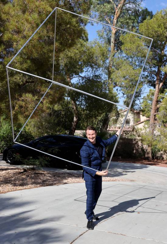 Former Olympian and former Cirque du Soleil performer Paul Bowler spins a cube used in his act ...