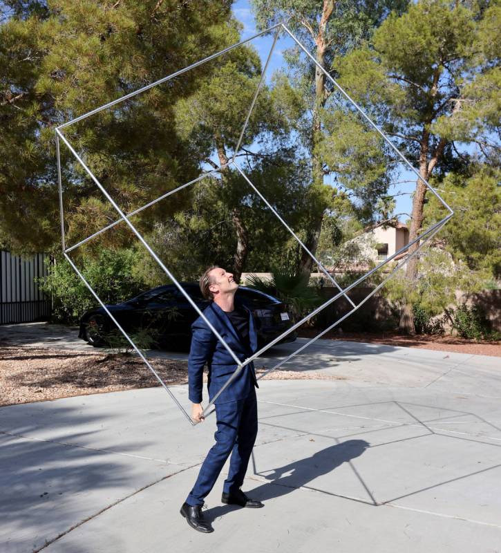 Former Olympian and former Cirque du Soleil performer Paul Bowler spins a cube used in his act ...