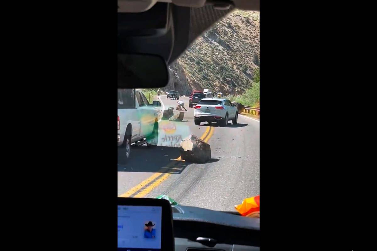 This image from video provided by Brett Durrant shows boulders blocking U.S. Route 395 near the ...
