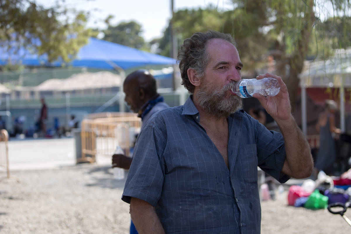 Gary Brown, who said he has been in Las Vegas for 20 years by way of New York, drinks water at ...