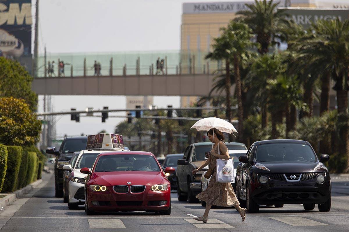 Meagan Ghorashian of Portland runs on the crosswalk near Planet Hollywood hotel-casino in Las V ...