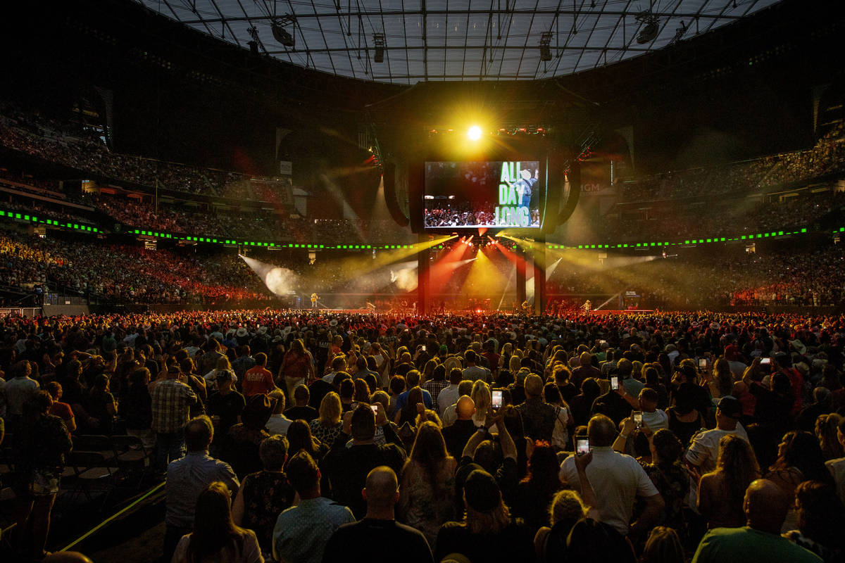 Garth Brooks performs before the crowd at Allegiant Stadium on Friday, July 10 2021, in Las Veg ...