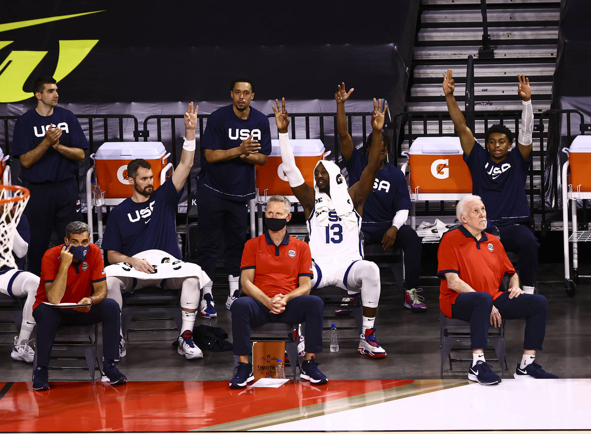 USA Basketball players celebrate a three-pointer by Jerami Grant, not pictured, during the firs ...