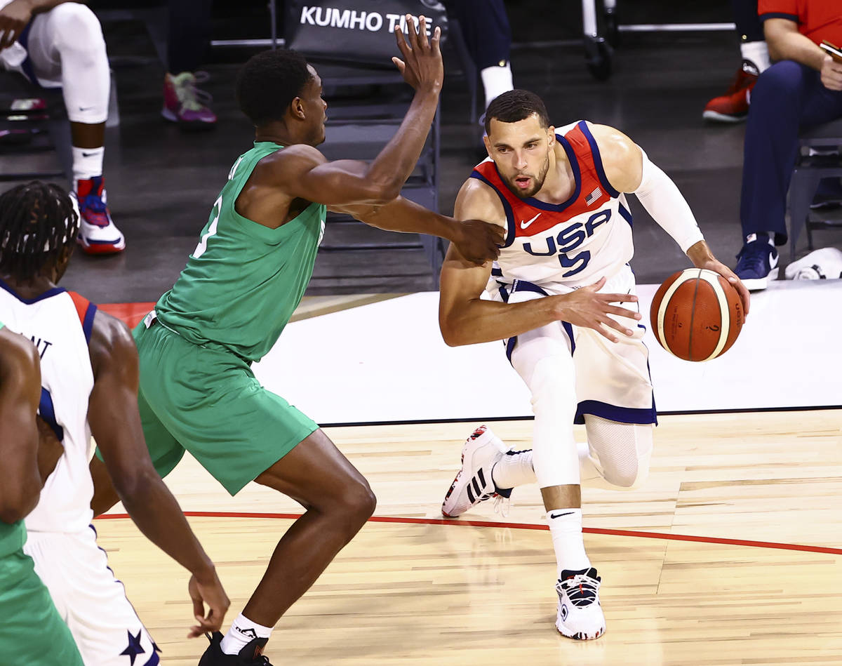 USA Basketball's Zach Lavine (5) drives the ball around Nigeria’s Caleb Agada (3) during ...