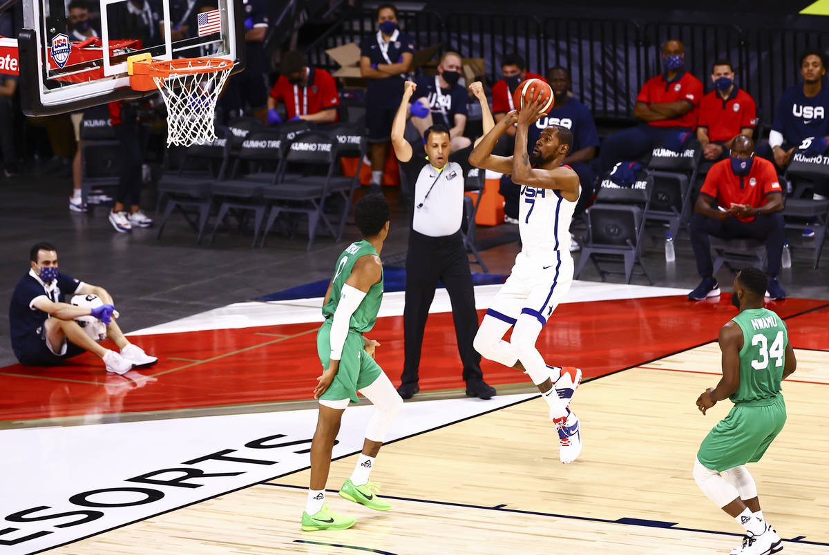 USA Basketball's Kevin Durant (7) shoots over Nigeria’s KZ Okpala (0) during the first h ...